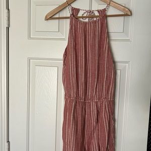 Super cute romper with pockets! Elastic waist and tie back. Muted red color. EUC